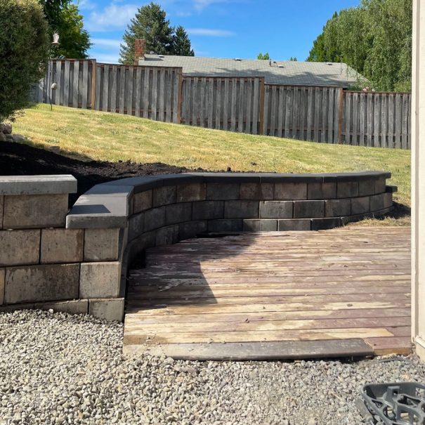 Finished retaining wall and deck transition by Weeping Willow